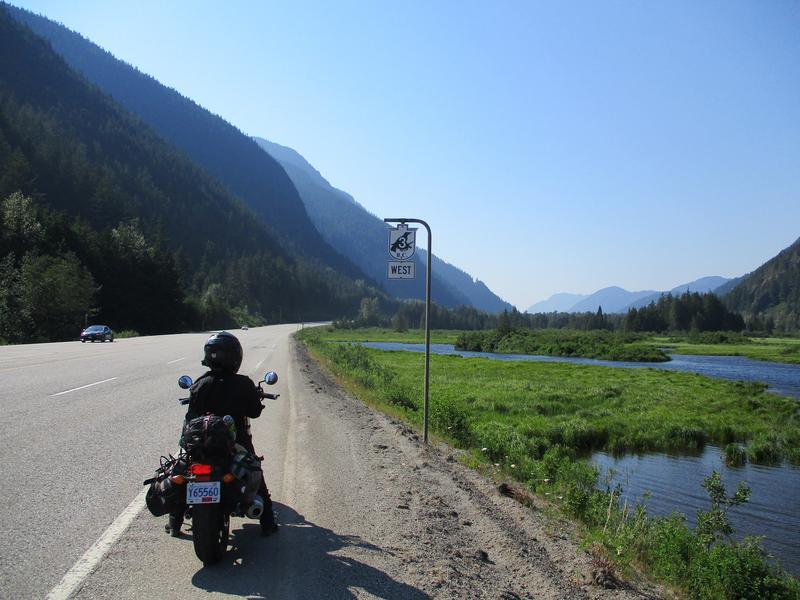 Meredith beside crowsnest highway sign